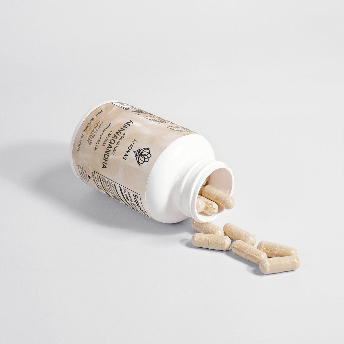 Amonas ashwagandha capsules with black pepper spilling from bottle